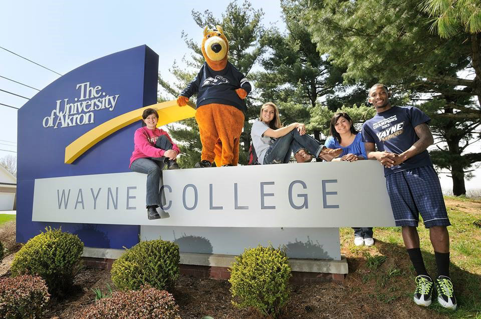 Wayne College students & Zippy sitting atop Wayne Collge sign